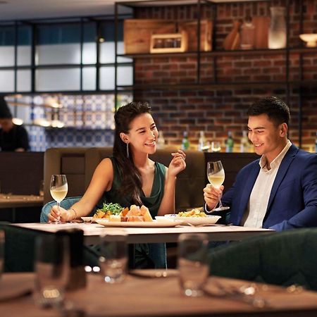 Doubletree By Hilton Shah Alam I-City Exterior photo A couple dining at a restaurant